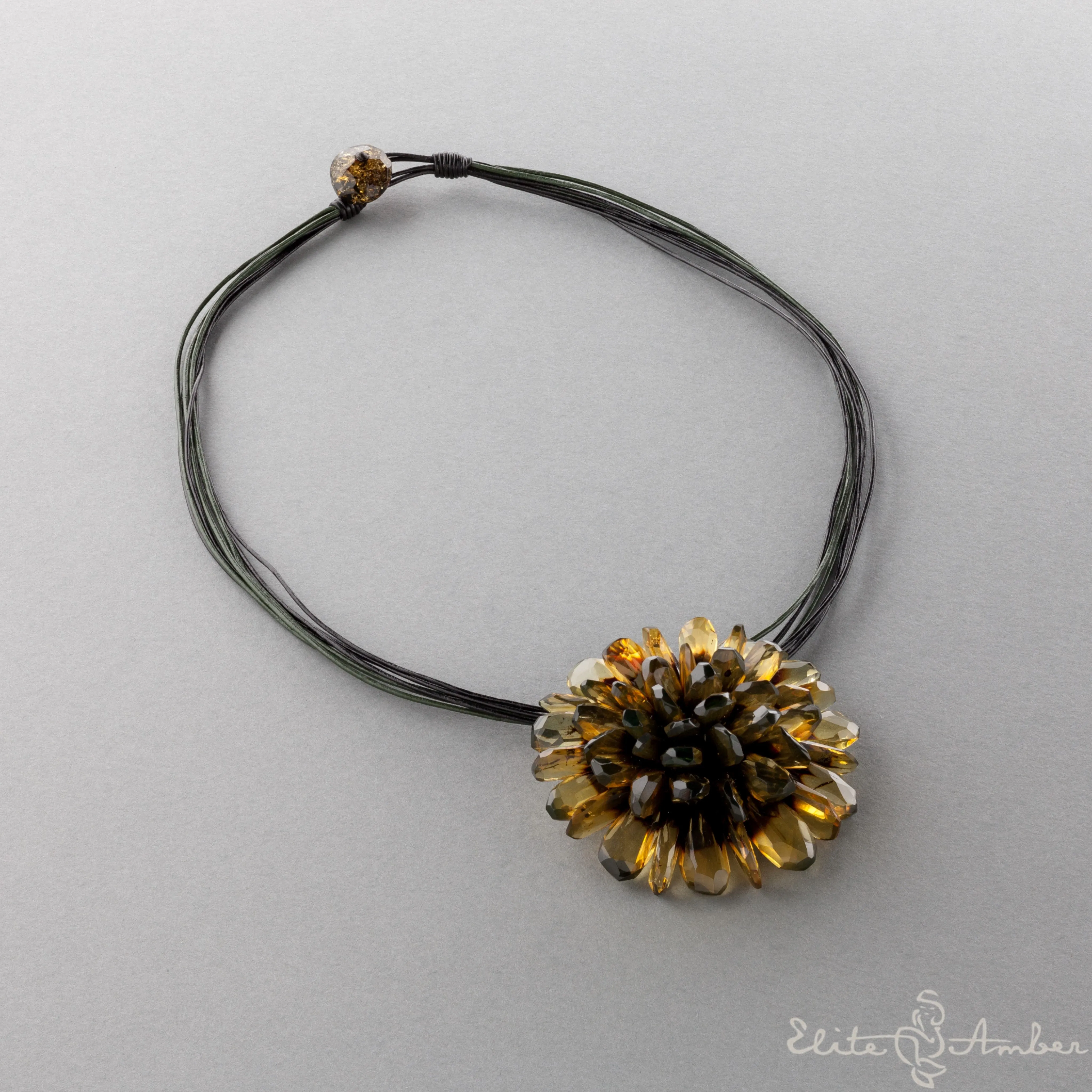 Amber brooch-pendant "Black flower"