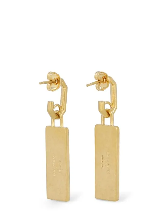 Balmain   Signature tubular brass earrings 