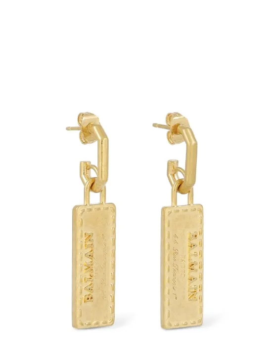 Balmain   Signature tubular brass earrings 